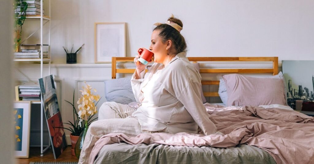 Woman-Sitting-on-Her-Bed-and-Drinking-Tea-facebook-1200×628-1