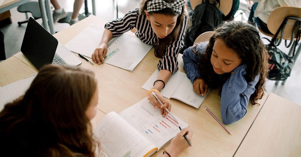 high-angle-view-female-girl-students-studying-classroom-school-1200×628-facebook-1