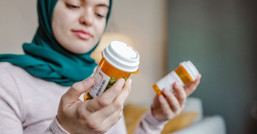 woman-holding-a-medicine-pill-bottle-faacebook